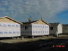 Inmates constructing houses at Mike Durfee State Prison.